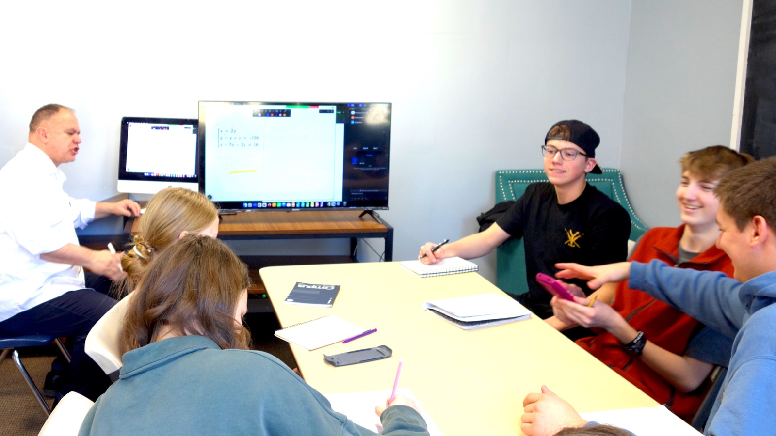 Students working together around a table in Provo